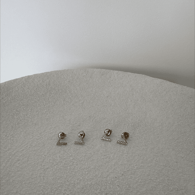 BOUCLES D’OREILLES HISTÓRIA